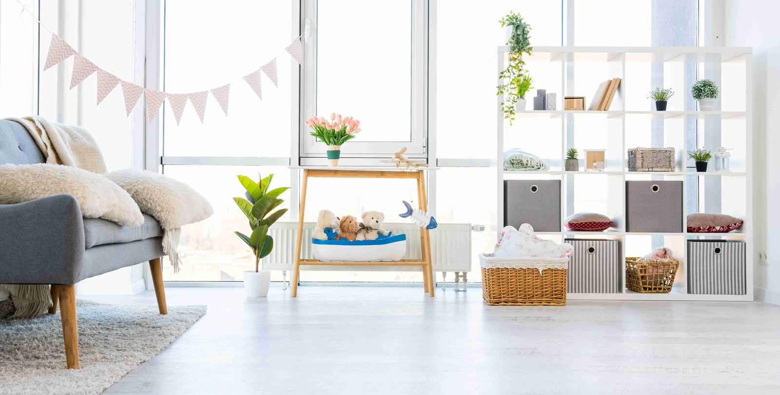 A bright, organized room interior with shelving and storage organizers